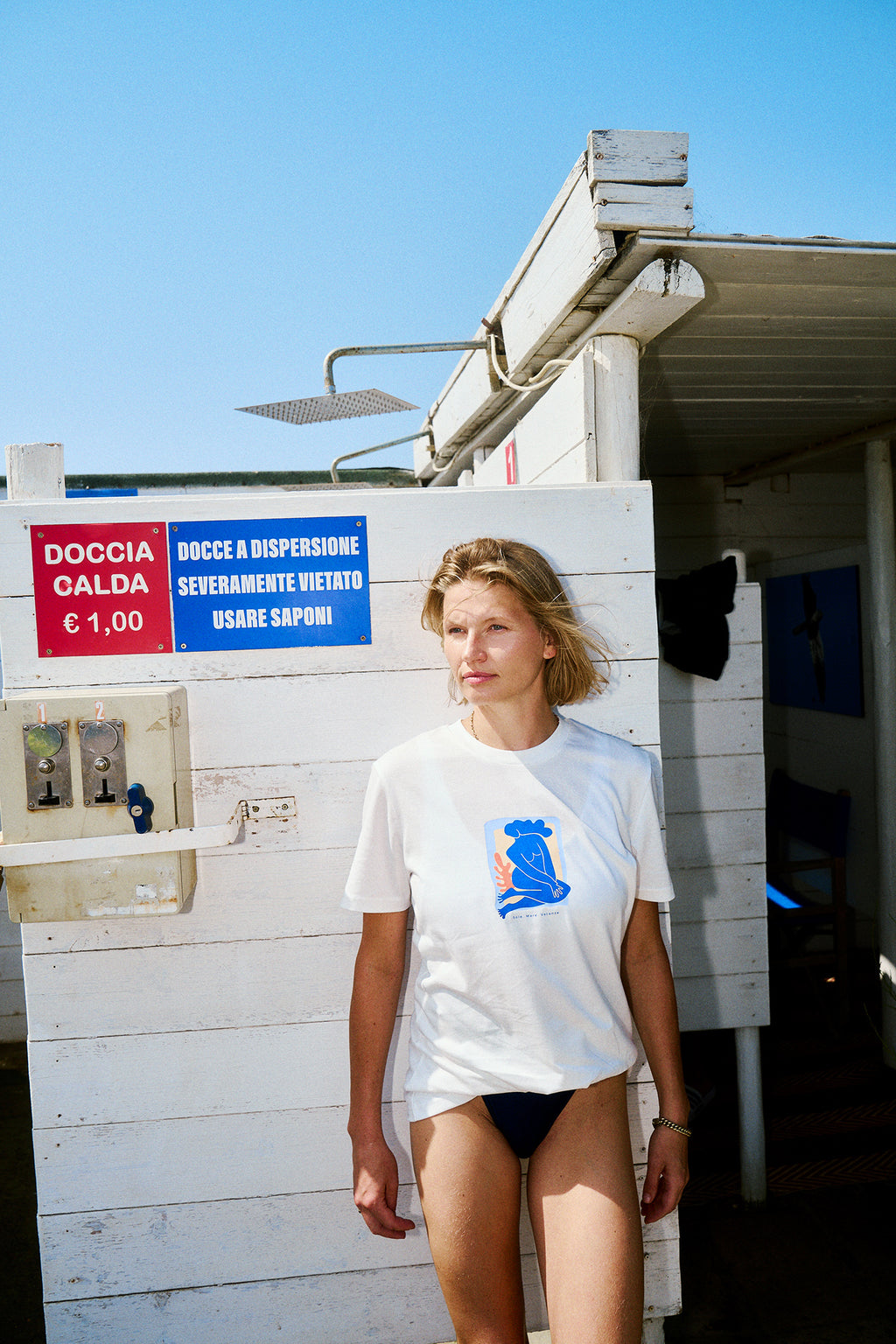 The Sole Mare Vacanze white unisex t-shirt features an original mermaid graphic inspired by the carefree spirit of Italian summers. Designed for everyday comfort, this premium cotton tee combines timeless style with a relaxed vacation mood.

Made from high-quality cotton, this white graphic t-shirt offers a comfortable unisex fit and effortless versatility. Pair it with denim, linen trousers or shorts for an easy look inspired by the Mediterranean coast.

Whether you're heading to the beach, exploring the c
