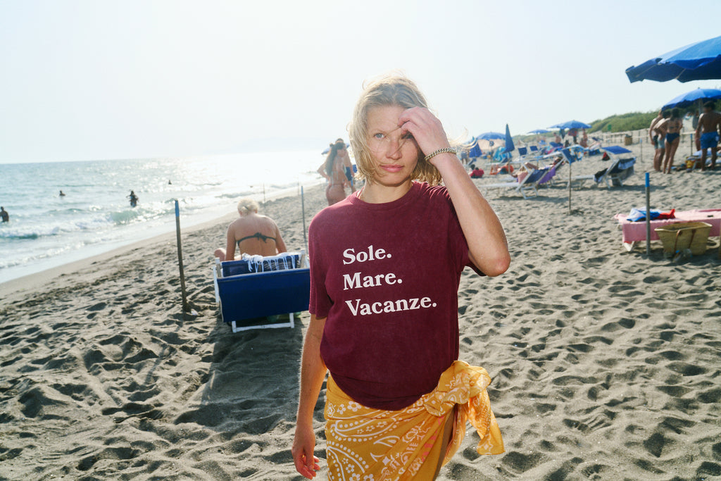 Burgundy washed unisex t-shirt made from premium cotton. A timeless everyday essential with a vintage finish by Sole Mare Vacanze.