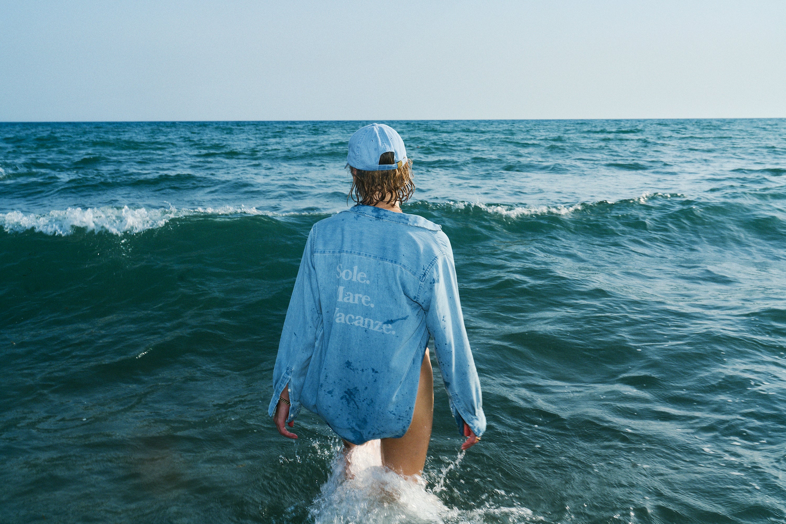 Sole Mare Vacanze denim shirt by Drivemebikini – unisex with laser artwork on the back