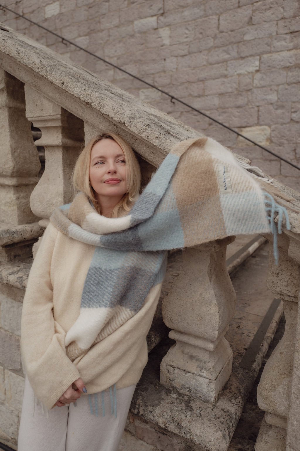 Plaid alpaca and wool scarf – soft, luxurious, made in Italy, colors: light blue, beige, and cream.