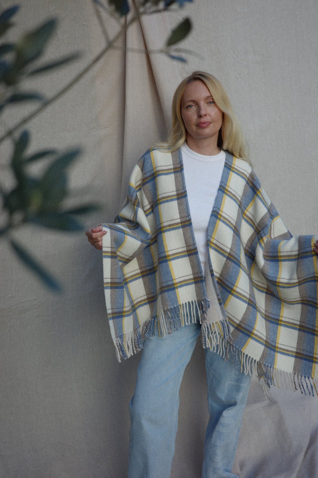 Wrap yourself in effortless elegance with the Sole Mare Vacanze wool poncho. Made from premium virgin wool, it offers exceptional softness, warmth, and lightness