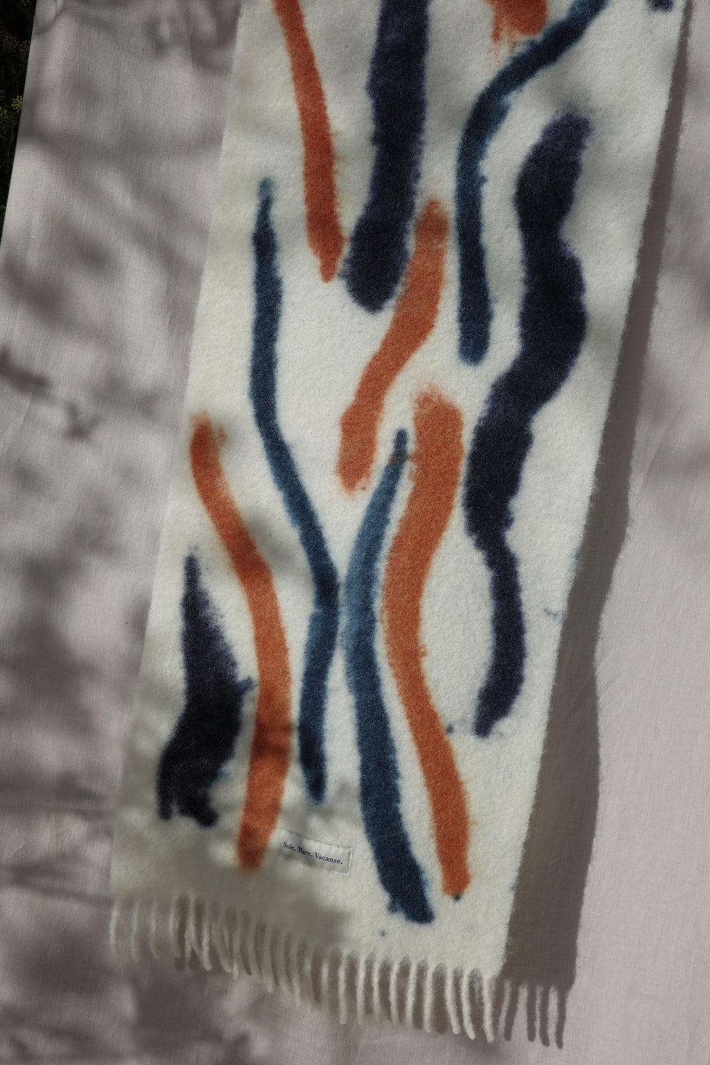 Discover the Sole Mare Vacanze alpaca scarf — where Mediterranean elegance meets effortless style. Inspired by the spirit of an eternal vacation, it captures good vibes and Italian sunshine in every thread. Handcrafted in Umbria, this timeless design offers lightness, softness, and pure luxury made in Italy.