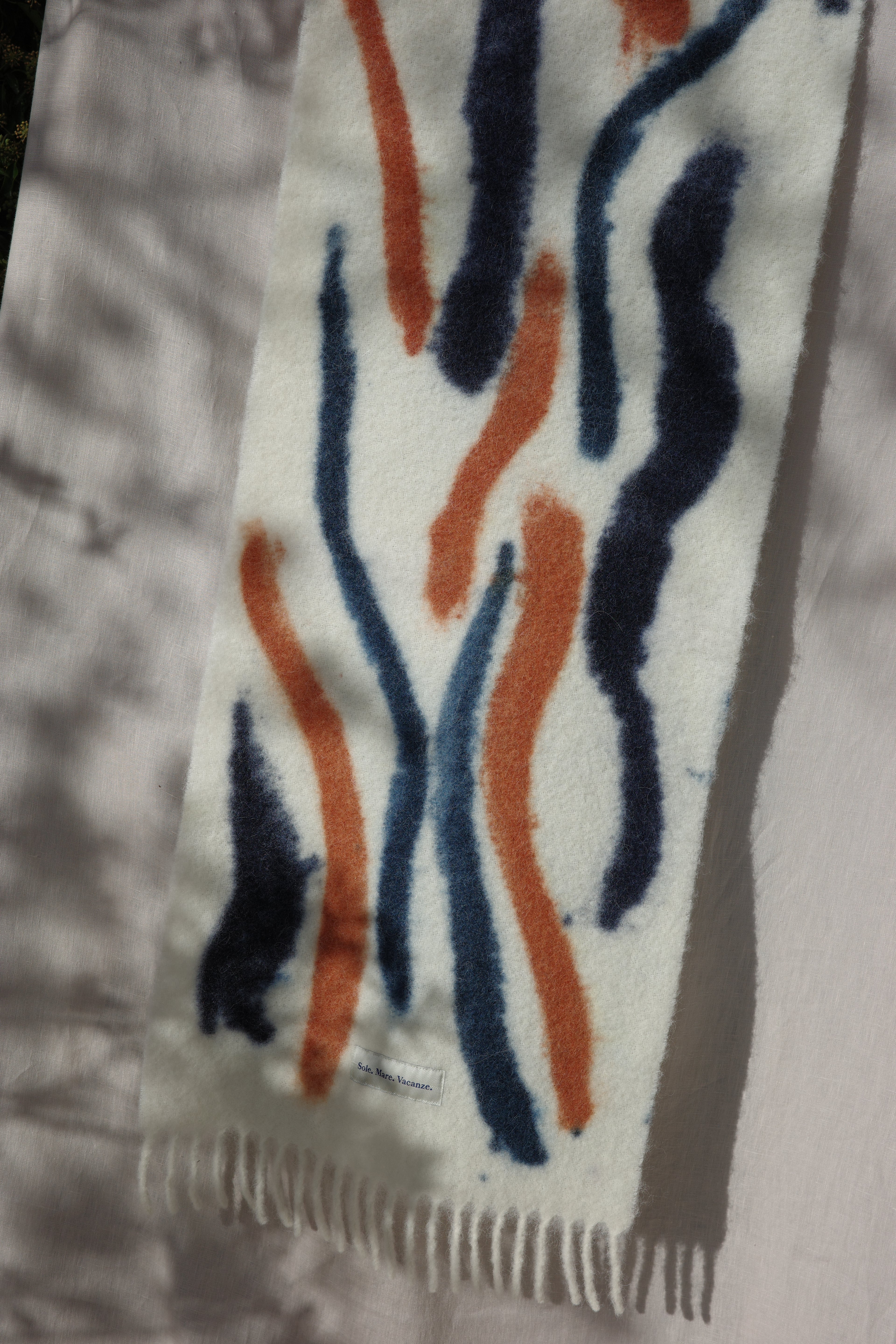 Discover the Sole Mare Vacanze alpaca scarf — where Mediterranean elegance meets effortless style. Inspired by the spirit of an eternal vacation, it captures good vibes and Italian sunshine in every thread. Handcrafted in Umbria, this timeless design offers lightness, softness, and pure luxury made in Italy.